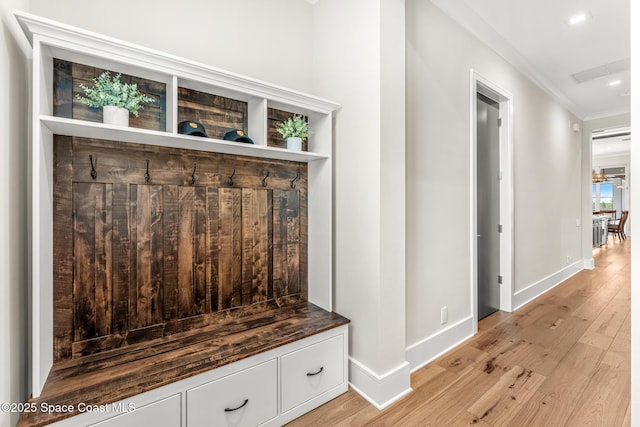 3778 Lake Adelaide Pl, Rockledge, FL 32955 - mudroom featuring light wood-type flooring, crown molding, and recessed lighting