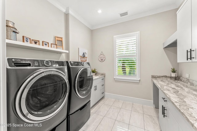 3778 Lake Adelaide Pl, Rockledge, FL 32955 - laundry room with washing machine and dryer, crown molding, and cabinet space