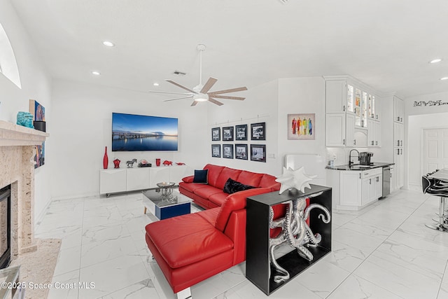 227 Loggerhead Dr, Melbourne Beach, FL 32951 - living room featuring light marble finish flooring, ceiling fan, recessed lighting, and a premium fireplace