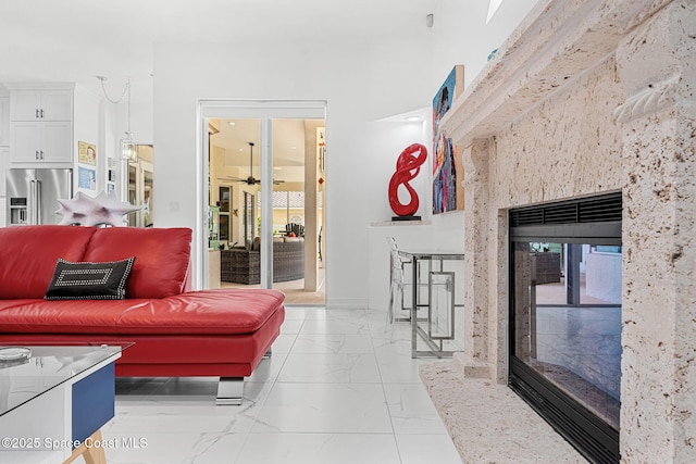 227 Loggerhead Dr, Melbourne Beach, FL 32951 - living area with light marble finish flooring and a high end fireplace