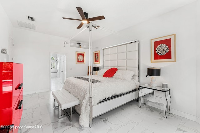 227 Loggerhead Dr, Melbourne Beach, FL 32951 - bedroom with marble look tiles, ceiling fan, and ensuite bathroom