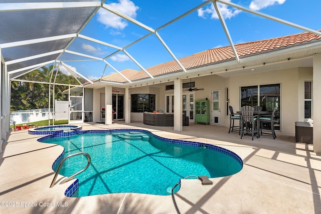 227 Loggerhead Dr, Melbourne Beach, FL 32951 - view of swimming pool with a pool with connected hot tub, a patio, ceiling fan, and glass enclosure