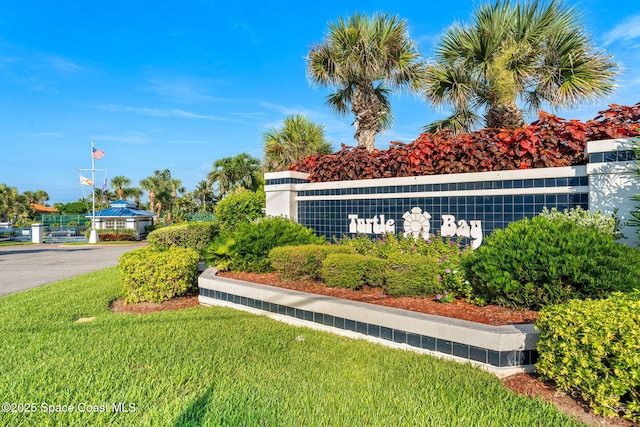 227 Loggerhead Dr, Melbourne Beach, FL 32951 - community sign featuring a lawn