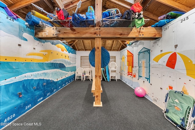 227 Loggerhead Dr, Melbourne Beach, FL 32951 - unfurnished bedroom featuring vaulted ceiling