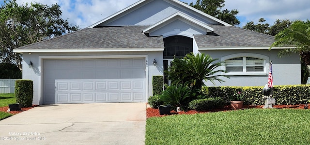 688 Naples Ct, West Melbourne, FL 32904 - single story home featuring roof with shingles, stucco siding, concrete driveway, a garage, and a front lawn