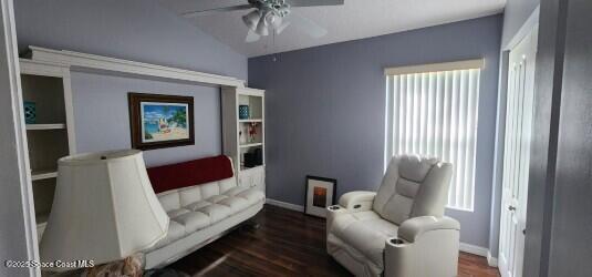 688 Naples Ct, West Melbourne, FL 32904 - living area with a ceiling fan, wood finished floors, healthy amount of natural light, and vaulted ceiling