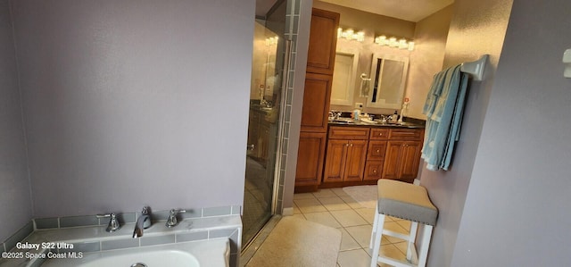 688 Naples Ct, West Melbourne, FL 32904 - full bathroom with a stall shower, a bath, double vanity, and tile patterned floors