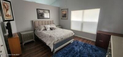 688 Naples Ct, West Melbourne, FL 32904 - bedroom with dark wood finished floors and vaulted ceiling