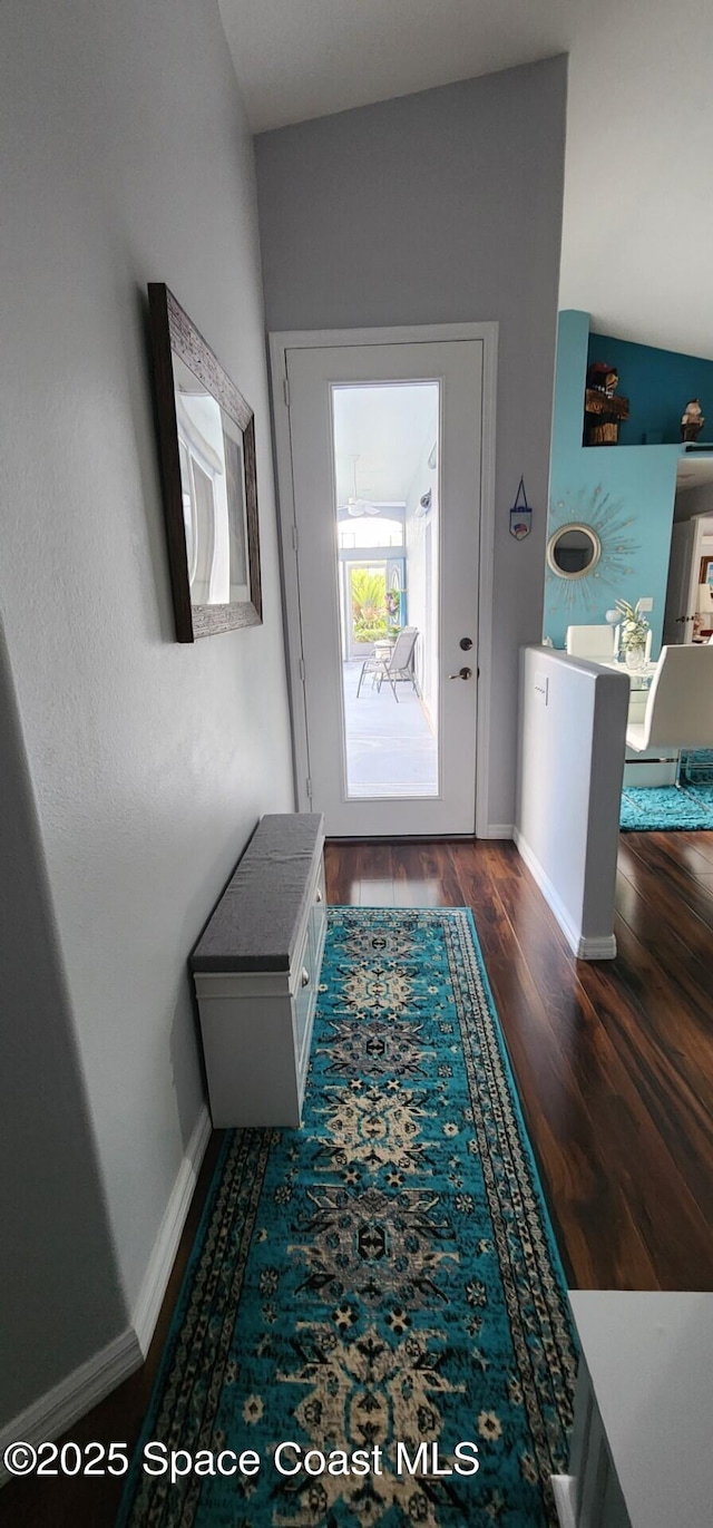 688 Naples Ct, West Melbourne, FL 32904 - entrance foyer with dark wood-style floors and baseboards