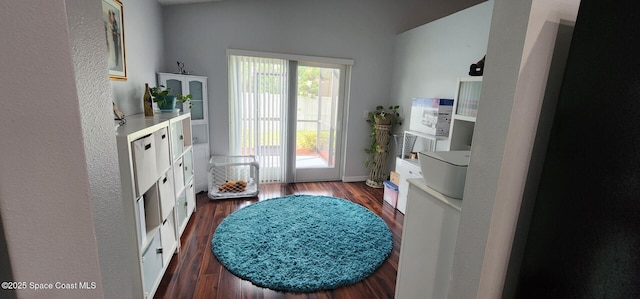 688 Naples Ct, West Melbourne, FL 32904 - doorway to outside featuring dark wood finished floors and baseboards