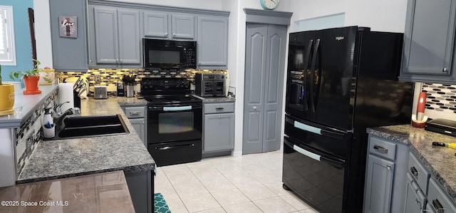 688 Naples Ct, West Melbourne, FL 32904 - kitchen with black appliances, backsplash, light tile patterned floors, and gray cabinetry