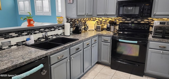 688 Naples Ct, West Melbourne, FL 32904 - kitchen with black appliances, gray cabinetry, tasteful backsplash, and light tile patterned flooring