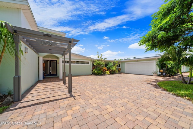 1732 Bay Shore Dr, Cocoa Beach, FL 32931 - view of patio / terrace with a garage and decorative driveway