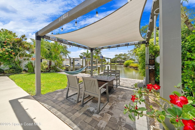1732 Bay Shore Dr, Cocoa Beach, FL 32931 - view of patio / terrace featuring a water view, a dock, and boat lift