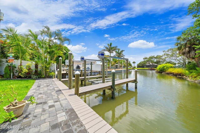 1732 Bay Shore Dr, Cocoa Beach, FL 32931 - dock area featuring boat lift and a water view