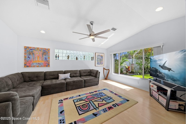 1732 Bay Shore Dr, Cocoa Beach, FL 32931 - living room featuring lofted ceiling, a ceiling fan, wood finished floors, and recessed lighting
