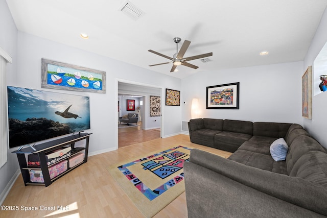 1732 Bay Shore Dr, Cocoa Beach, FL 32931 - living area with wood finished floors, ceiling fan, and recessed lighting