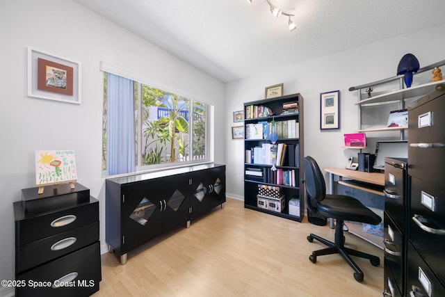 1732 Bay Shore Dr, Cocoa Beach, FL 32931 - office area with light wood-style flooring and track lighting