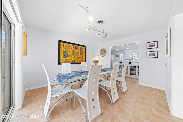 1732 Bay Shore Dr, Cocoa Beach, FL 32931 - dining space with light tile patterned floors and baseboards