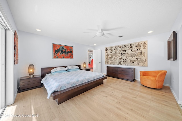 1732 Bay Shore Dr, Cocoa Beach, FL 32931 - bedroom with light wood-style flooring, recessed lighting, a ceiling fan, and a closet