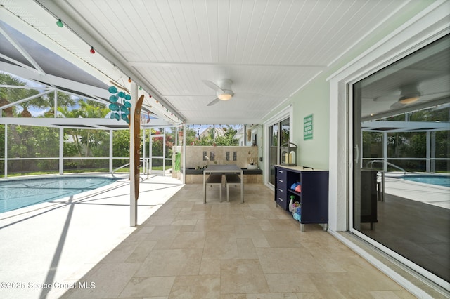 1732 Bay Shore Dr, Cocoa Beach, FL 32931 - swimming pool with a patio area, a ceiling fan, and a lanai