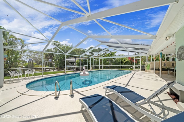 1732 Bay Shore Dr, Cocoa Beach, FL 32931 - swimming pool with a patio and glass enclosure