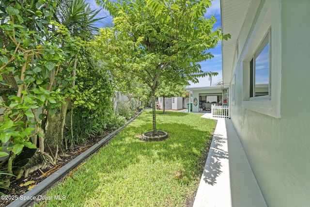 1732 Bay Shore Dr, Cocoa Beach, FL 32931 - view of yard with an outdoor structure
