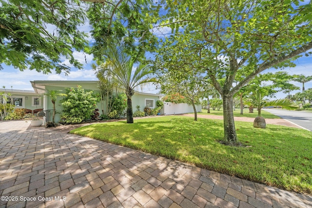 1732 Bay Shore Dr, Cocoa Beach, FL 32931 - view of front of house featuring a front yard