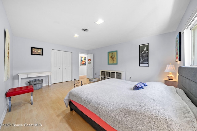 1732 Bay Shore Dr, Cocoa Beach, FL 32931 - bedroom with light wood-style floors and a closet