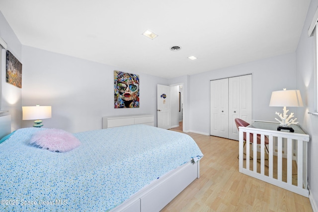 1732 Bay Shore Dr, Cocoa Beach, FL 32931 - bedroom with light wood-style floors and a closet