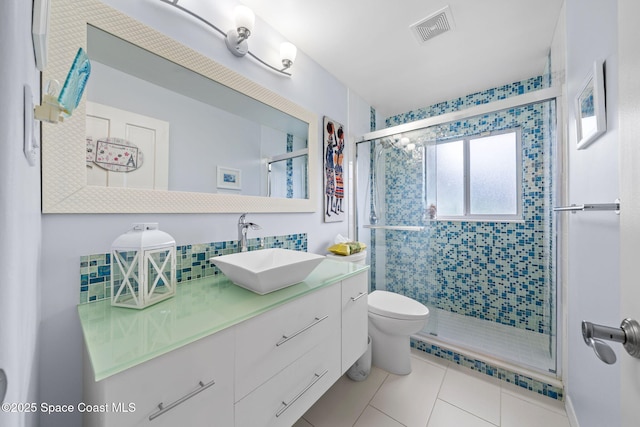 1732 Bay Shore Dr, Cocoa Beach, FL 32931 - bathroom with vanity, a shower stall, tile patterned floors, and decorative backsplash