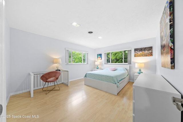 1732 Bay Shore Dr, Cocoa Beach, FL 32931 - bedroom with light wood-style flooring and baseboards