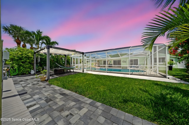 1732 Bay Shore Dr, Cocoa Beach, FL 32931 - view of green lawn featuring an outdoor pool, a patio area, and glass enclosure