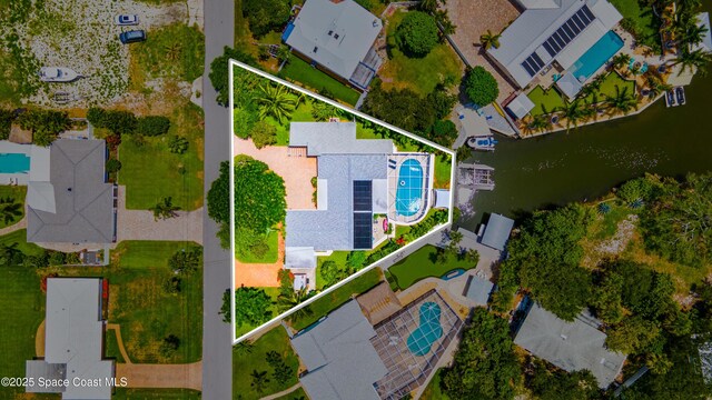 1732 Bay Shore Dr, Cocoa Beach, FL 32931 - aerial perspective of suburban area featuring a large body of water and property parcel outlined