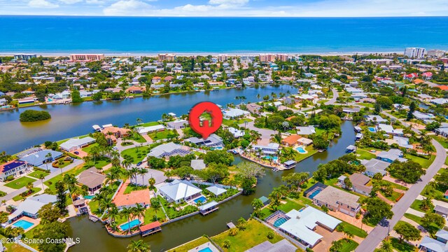 1732 Bay Shore Dr, Cocoa Beach, FL 32931 - view of property location featuring a large body of water and nearby suburban area