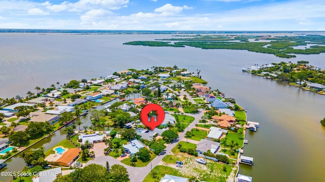 1732 Bay Shore Dr, Cocoa Beach, FL 32931 - aerial view of property and surrounding area featuring a large body of water and nearby suburban area