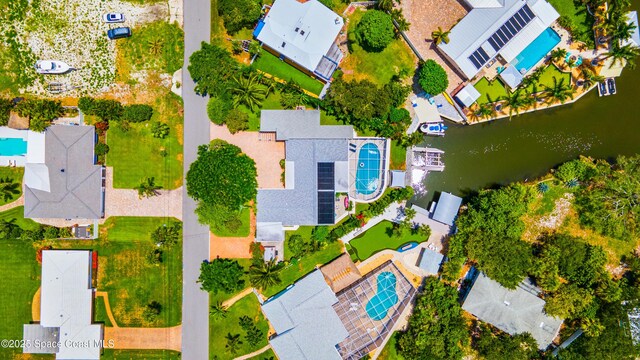 1732 Bay Shore Dr, Cocoa Beach, FL 32931 - aerial perspective of suburban area with a large body of water and a pool area