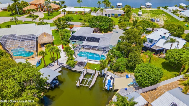 1732 Bay Shore Dr, Cocoa Beach, FL 32931 - aerial view of residential area featuring a pool and a large body of water