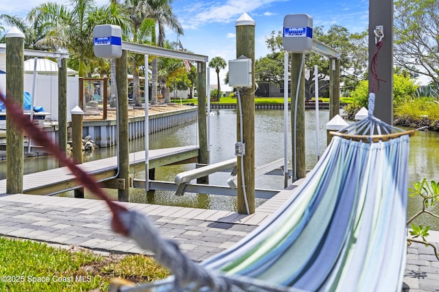 1732 Bay Shore Dr, Cocoa Beach, FL 32931 - dock with boat lift and a water view