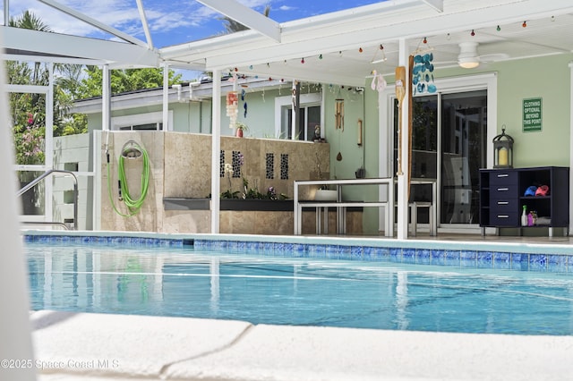 1732 Bay Shore Dr, Cocoa Beach, FL 32931 - outdoor pool featuring ceiling fan
