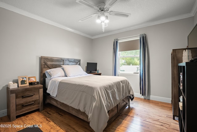 212 Olivick Cir NE, Palm Bay, FL 32907 - bedroom with crown molding, light wood finished floors, and ceiling fan