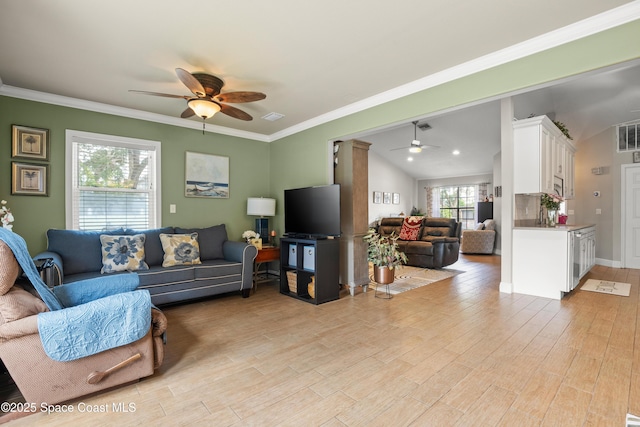 212 Olivick Cir NE, Palm Bay, FL 32907 - living room featuring ceiling fan, light wood-type flooring, and crown molding