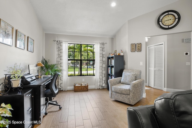 212 Olivick Cir NE, Palm Bay, FL 32907 - home office featuring light wood finished floors and lofted ceiling