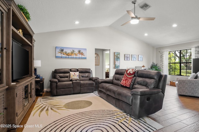 212 Olivick Cir NE, Palm Bay, FL 32907 - living room featuring light wood finished floors, vaulted ceiling, ceiling fan, and recessed lighting