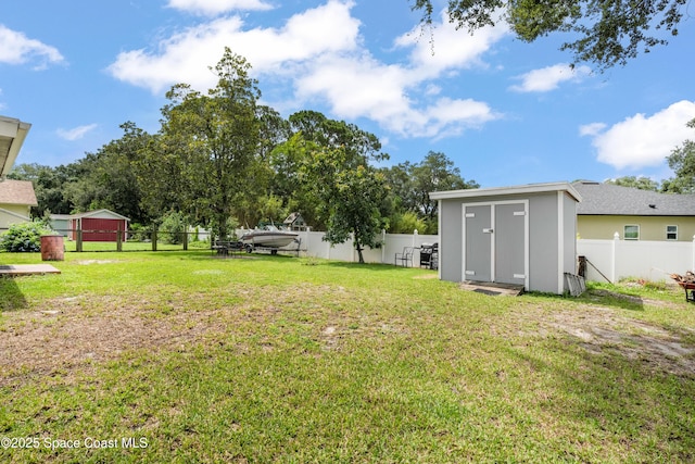 212 Olivick Cir NE, Palm Bay, FL 32907 - fenced backyard featuring a storage unit