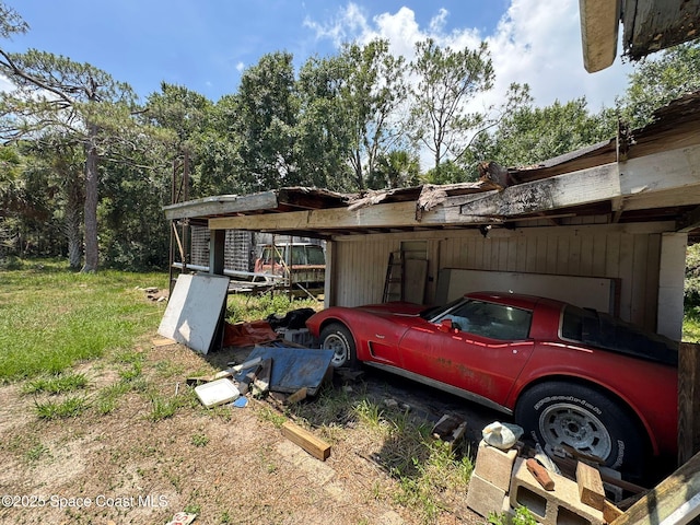 3105 Hield Rd, Melbourne, FL 32904 - view of side of home featuring an attached carport
