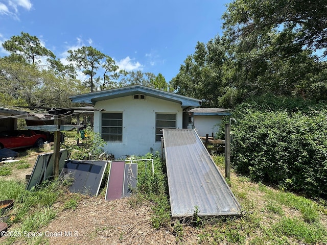 3105 Hield Rd, Melbourne, FL 32904 - view of home's exterior with stucco siding
