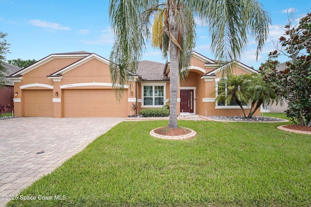 2690 Cypress Tree Trl, Saint Cloud, FL 34772 - single story home featuring stucco siding, decorative driveway, a front yard, and an attached garage