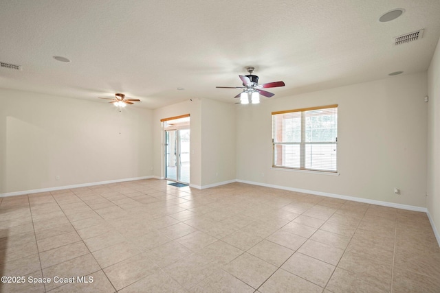 2690 Cypress Tree Trl, Saint Cloud, FL 34772 - spare room with a ceiling fan, plenty of natural light, and light tile patterned floors