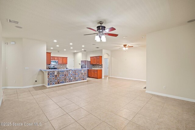 2690 Cypress Tree Trl, Saint Cloud, FL 34772 - unfurnished living room featuring ceiling fan, light tile patterned floors, and recessed lighting